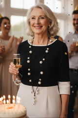 Woman celebrating with a cake and champagne wearing Faux Pearl Necklace – Unique Handmade Statement Jewelry for Wedding or Party