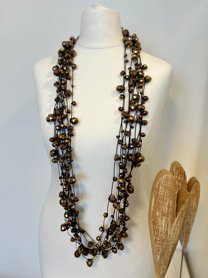 Crystal Faceted Beads on Rubber Necklace - Transparent Red